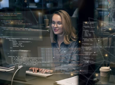 A woman working on laptop coding